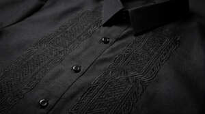 Close-up of black-on-black embroidery on a modern Barong Tagalog for gala events.